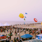 ബേപ്പൂര്‍ വാട്ടര്‍ഫെസ്റ്റ്: ബീച്ച് സ്‌പോര്‍ട്‌സ് മത്സരങ്ങള്‍ക്ക് നാളെ തുടക്കം Crowded beach with colorful kites.